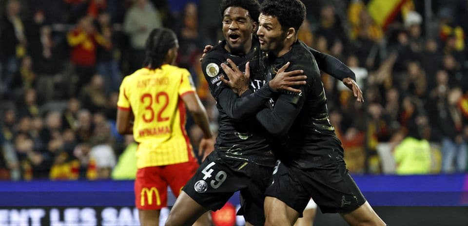 Players celebrating a goal during a match