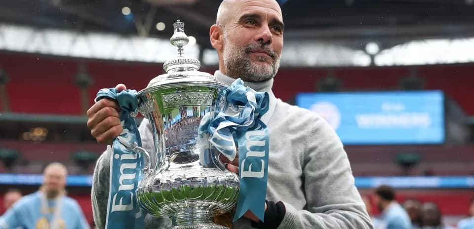 Coach holding trophy after winning match