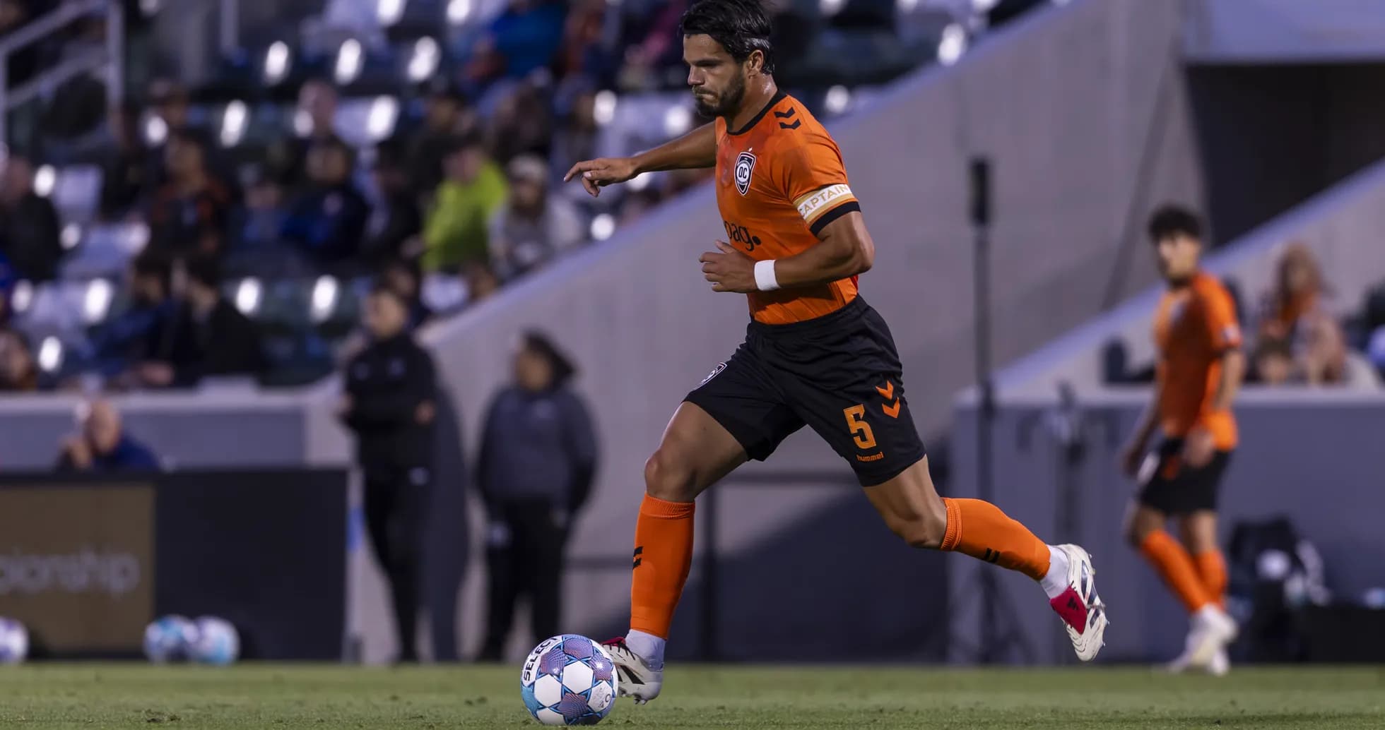 Player dribbling ball during New Mexico United match