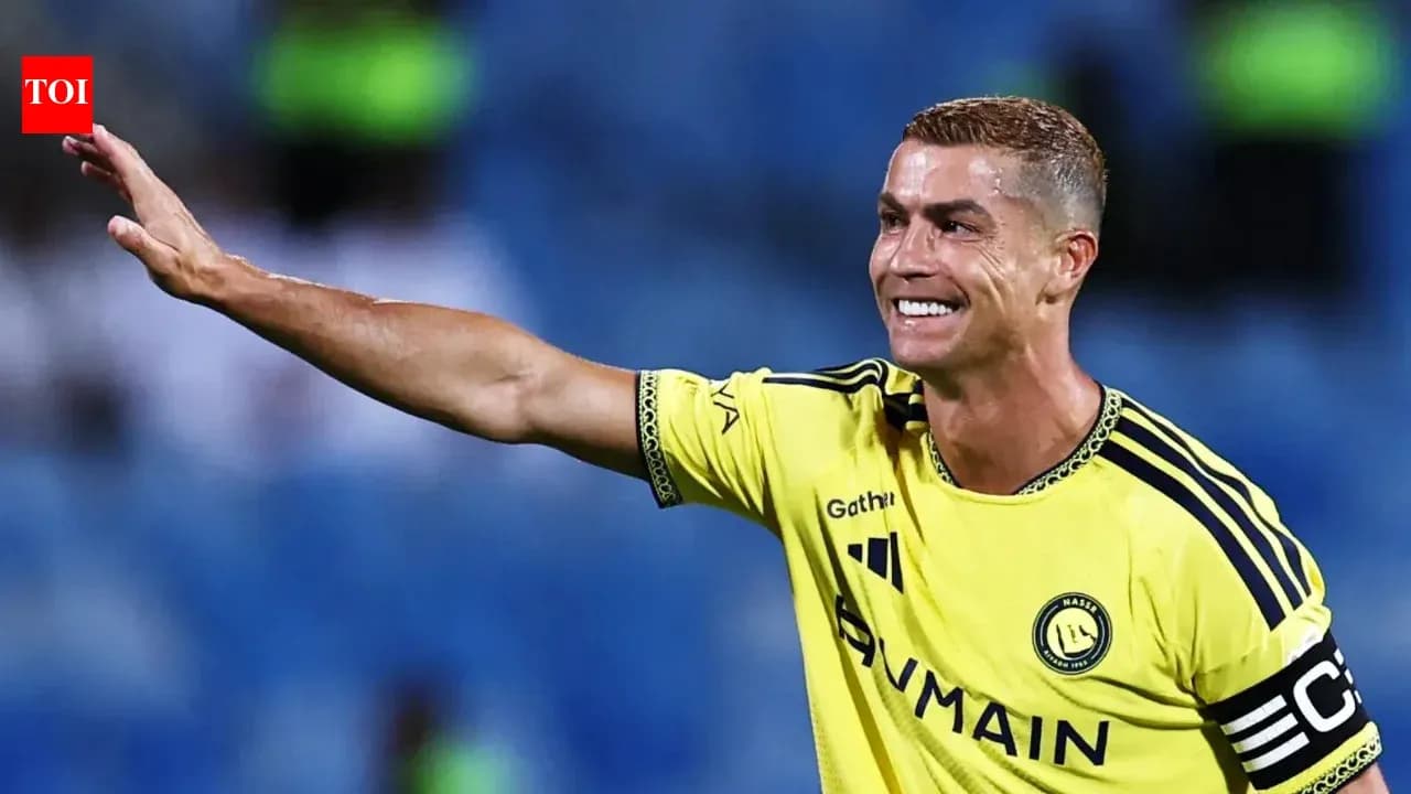 Player in yellow jersey waving to the crowd
