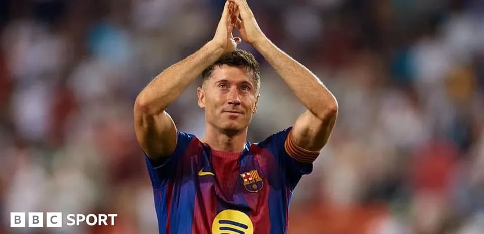 Player applauding fans wearing Barcelona jersey