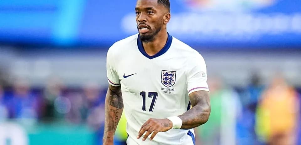 Player in England kit running on the pitch