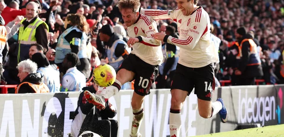 Players celebrating a goal during Liverpool match