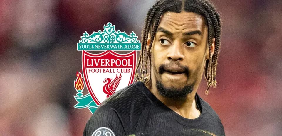 Player in Liverpool kit with club logo background