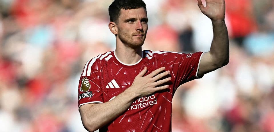 Player waving to fans in red jersey