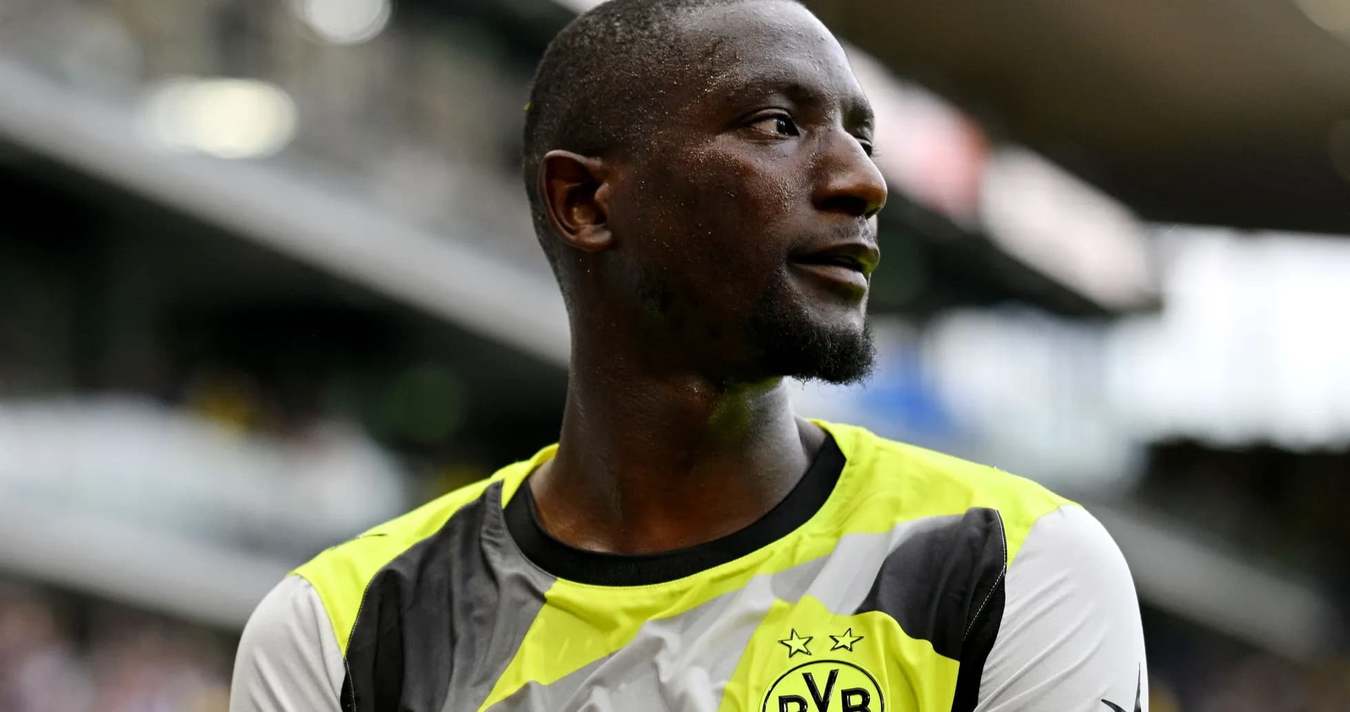 Player wearing Borussia Dortmund training kit on pitch