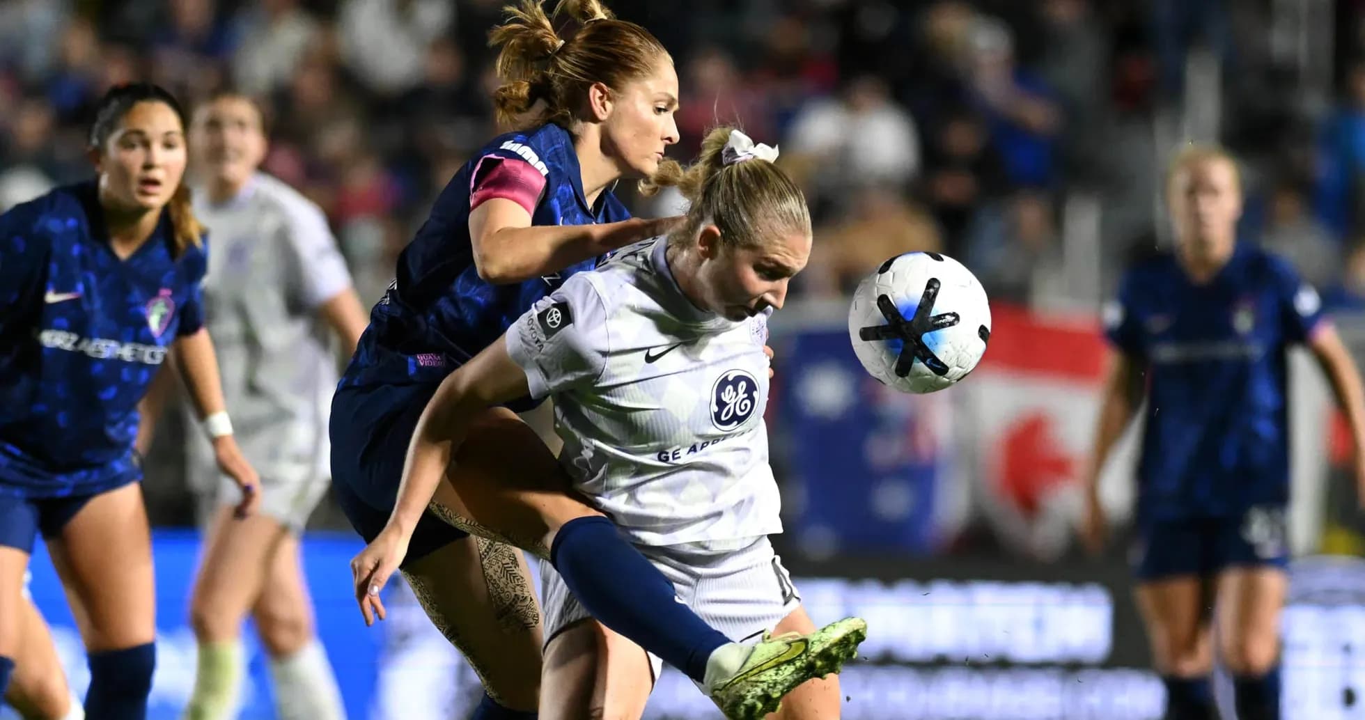 Players competing for the ball during match