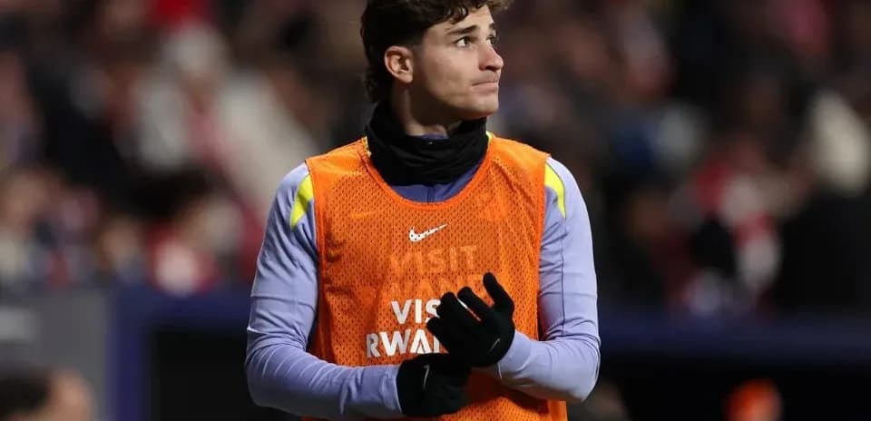 Goalkeeper warming up on the sidelines during match