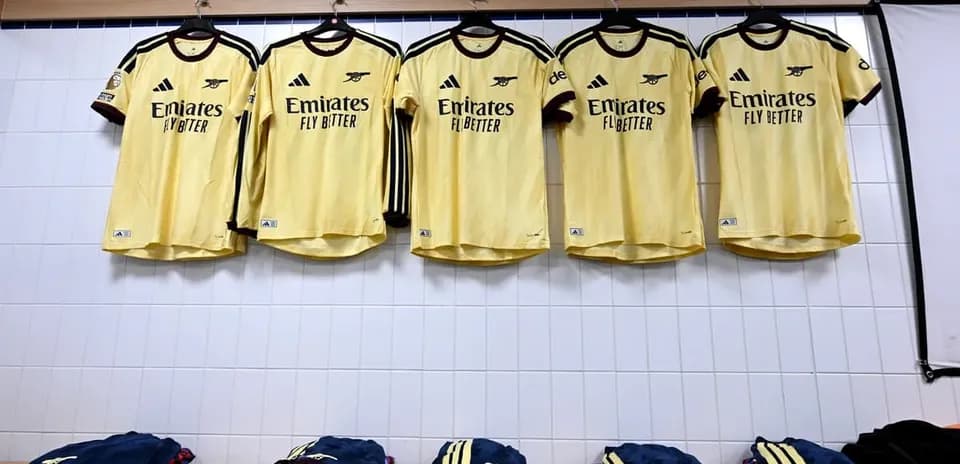 Arsenal jerseys hanging in a locker room