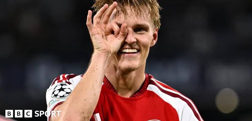Player celebrating with a hand gesture on field