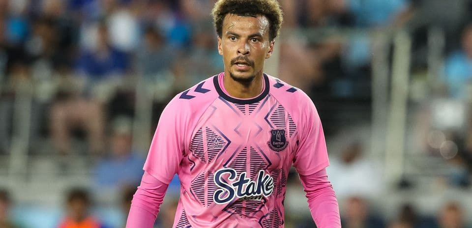 Goalkeeper wearing pink jersey during match