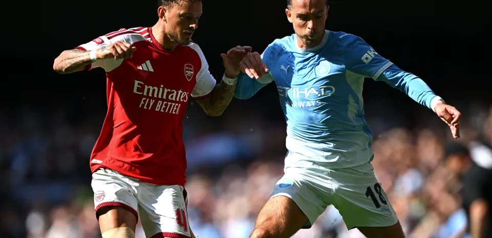Two players battling for the ball during match