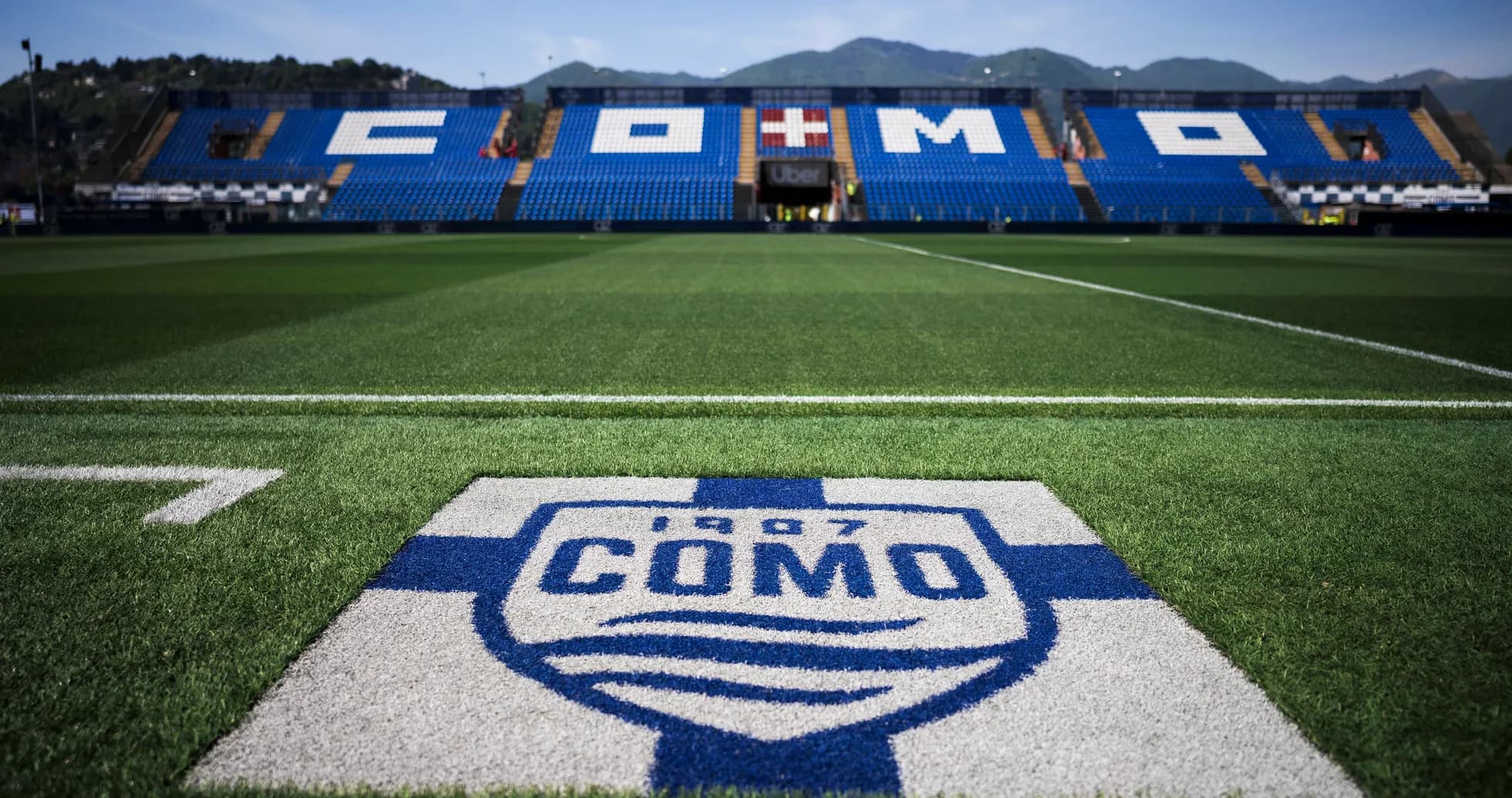 Como stadium field with team logo in foreground