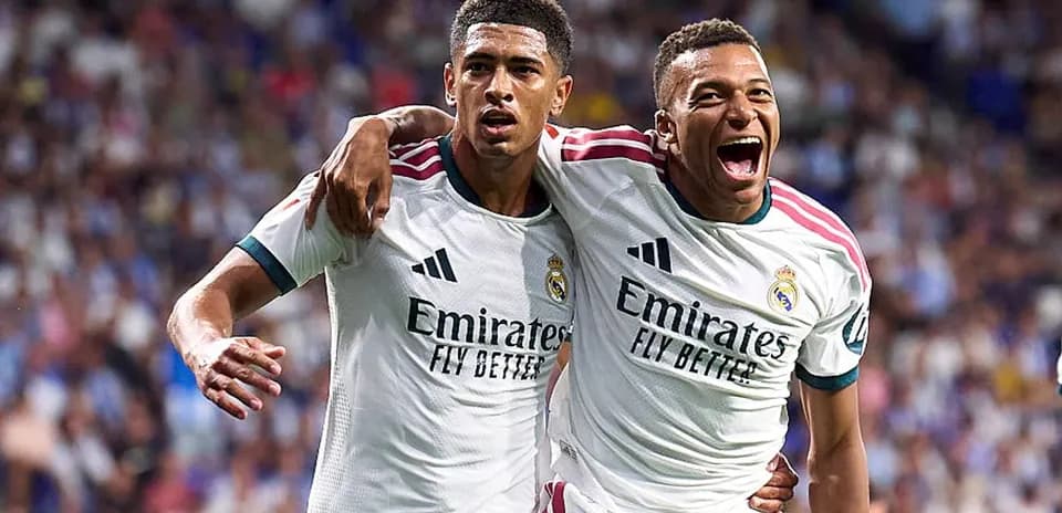 Two Real Madrid players celebrating a goal