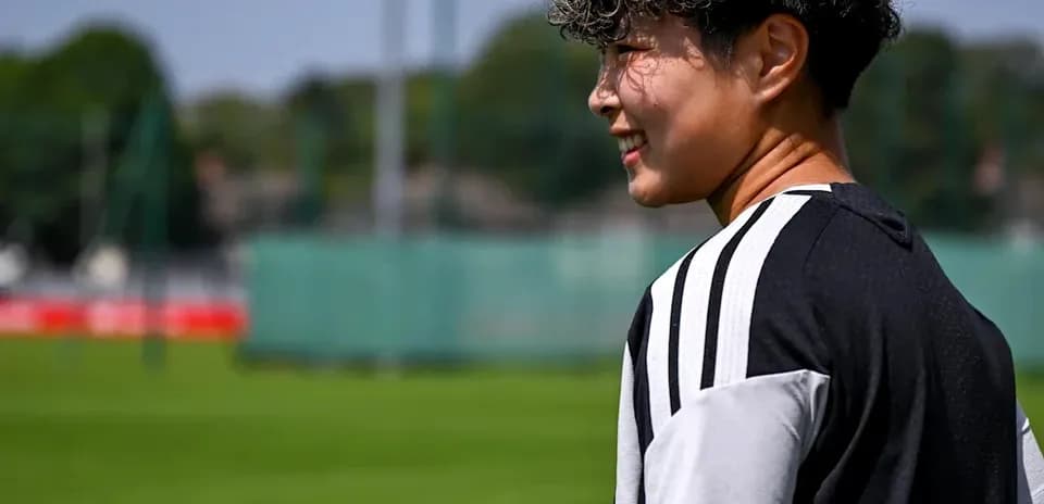 Player in training kit on football pitch