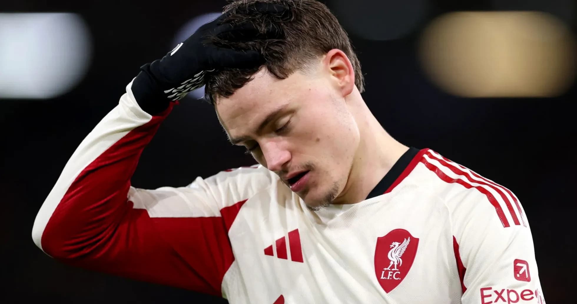 Player with Liverpool FC jersey looking down