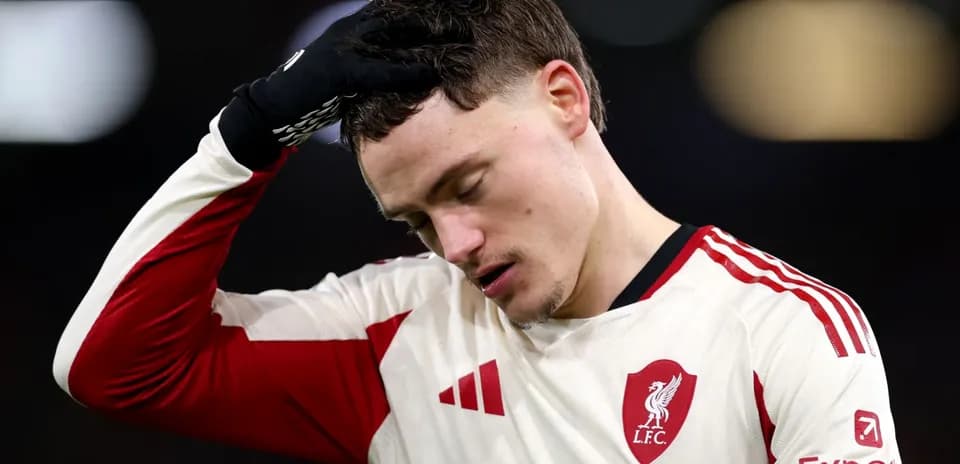 Player with Liverpool FC jersey looking down