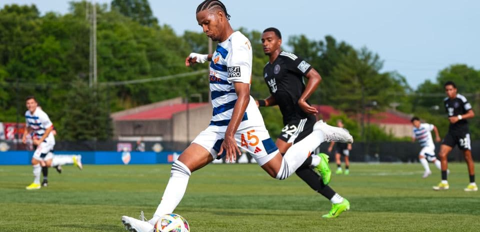 Player kicking the ball during Huntsville City match