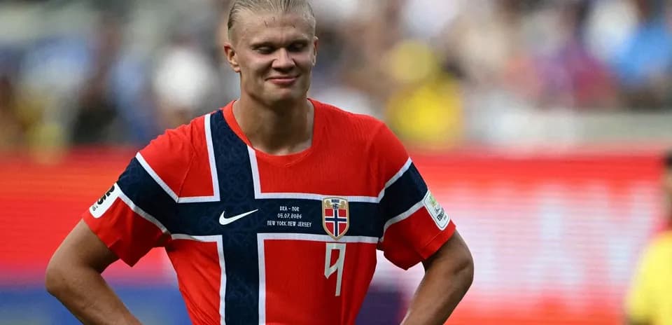 Player in Norway jersey during match, looking down