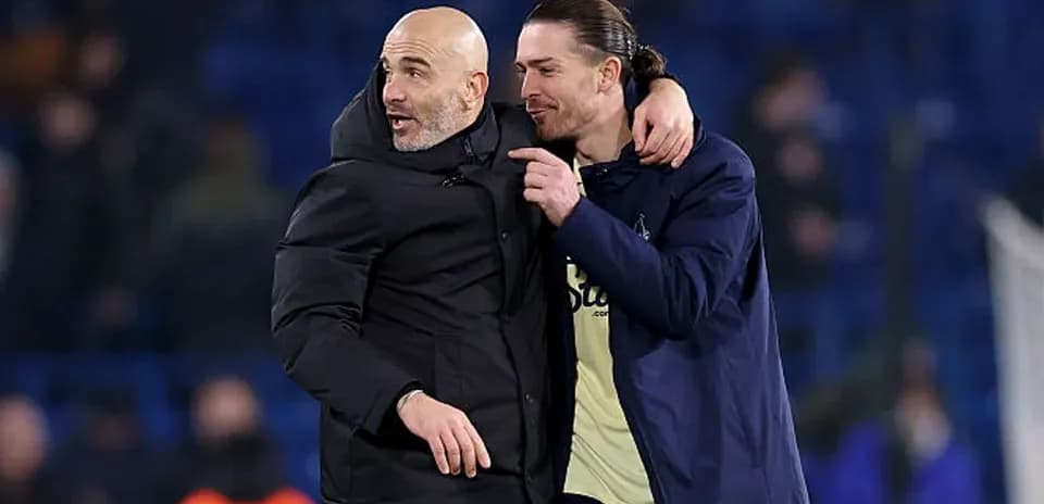 Coach and player celebrating on the field