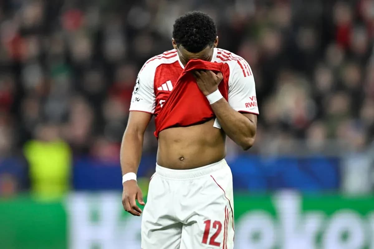 Player holding shirt to face on the field