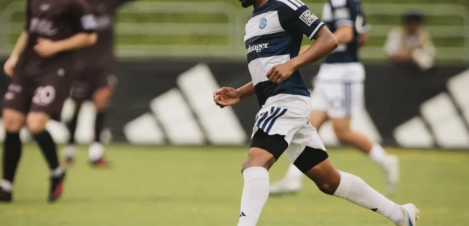 Player dribbling the ball during Chattanooga match