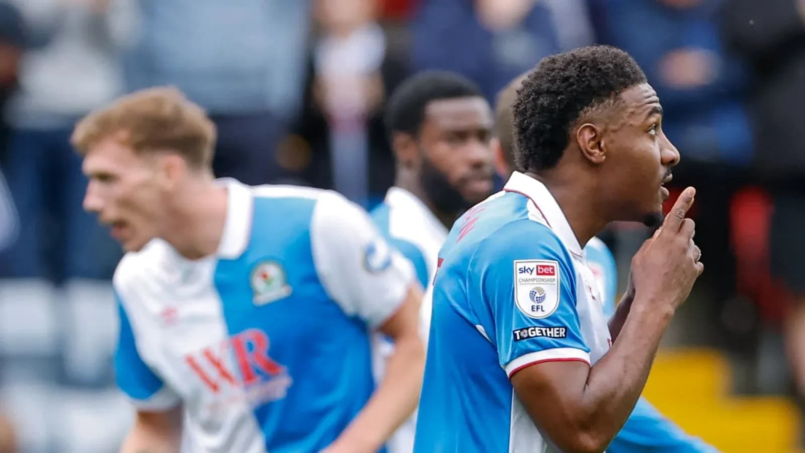 Player celebrating with a finger to lips gesture