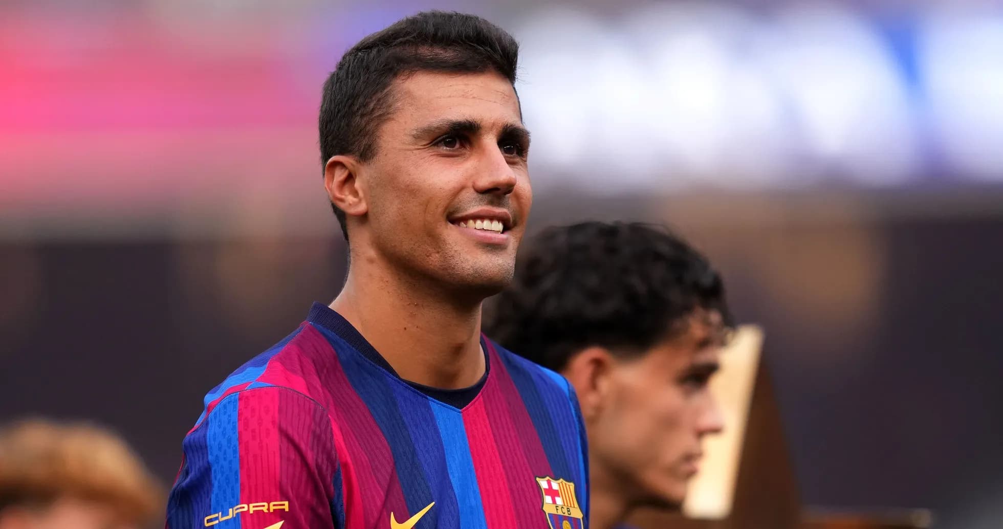 Player smiling during celebration at event