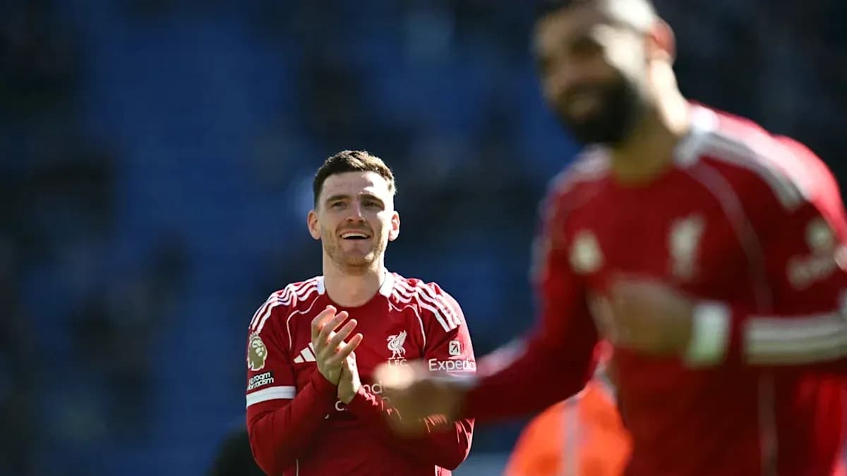 Liverpool players celebrating on the pitch after match