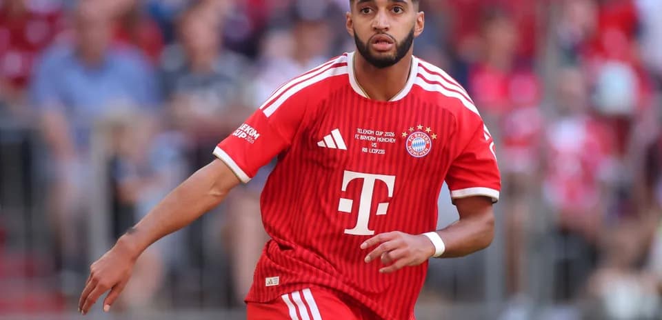 Player in red Bayern Munich kit running on field
