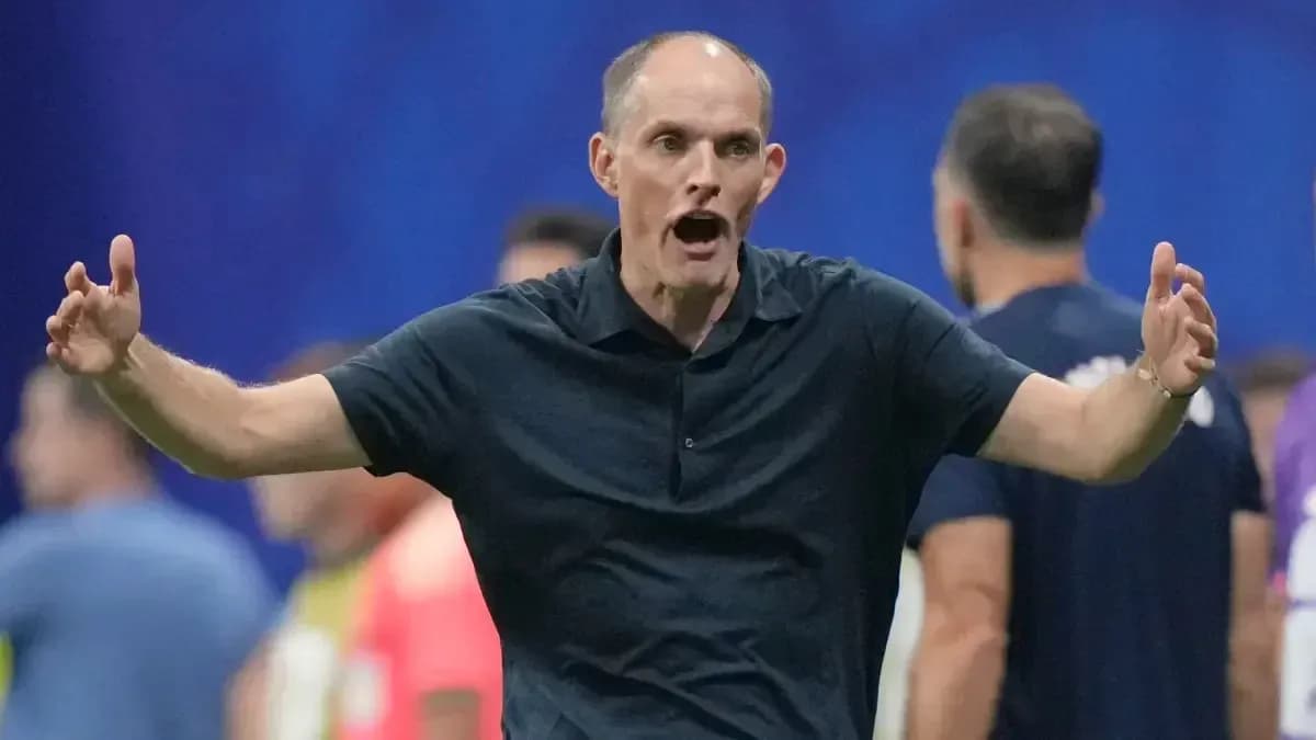 Coach gesturing during a match on the sidelines