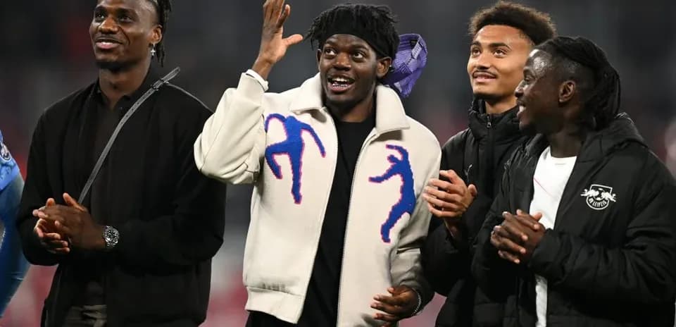 Four players interacting in a stadium setting