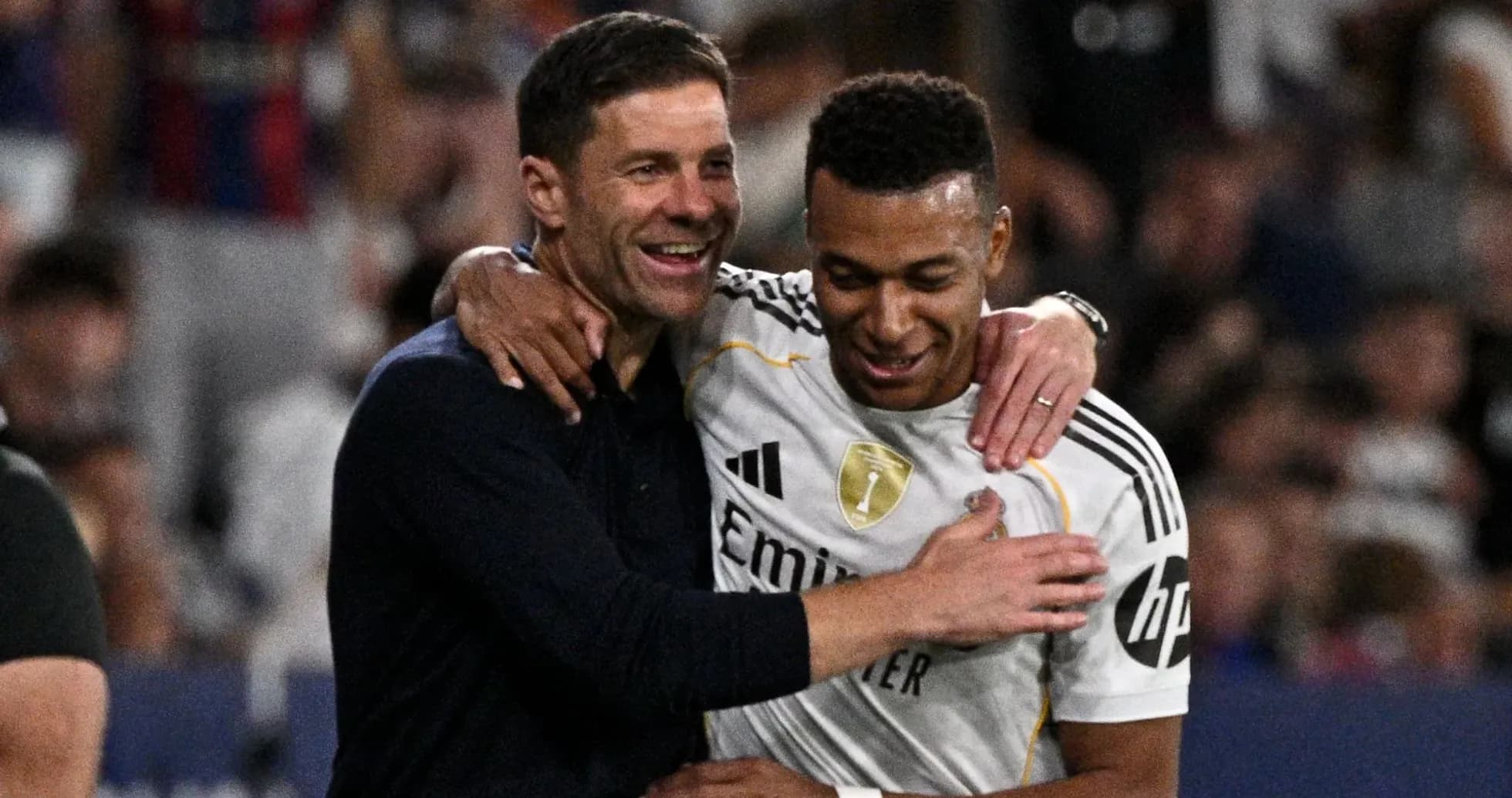 Coach and player celebrating after match victory