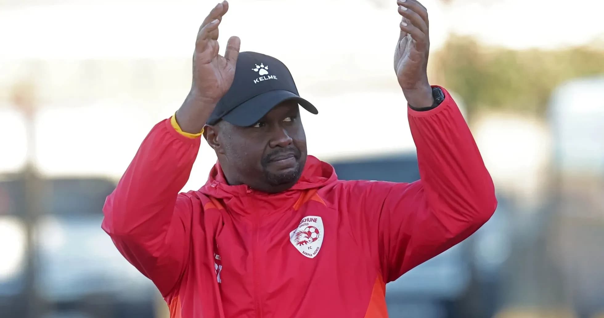 Coach applauding during training session