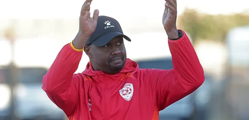 Coach applauding during training session