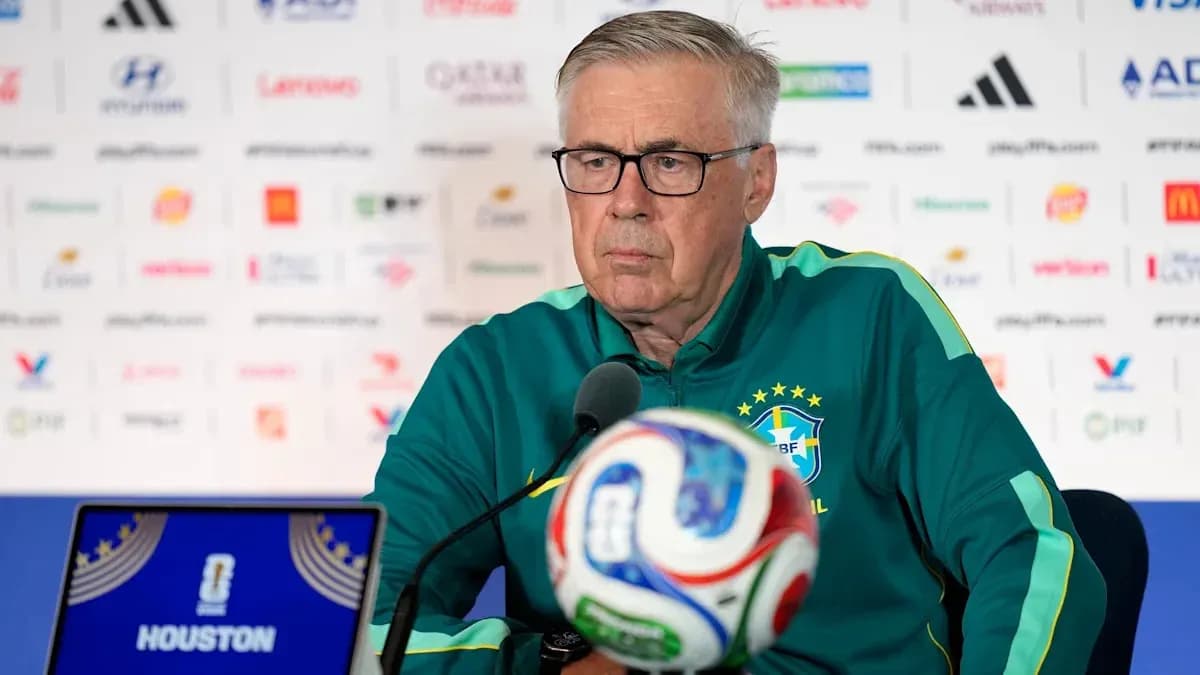 Manager at press conference with soccer ball in front