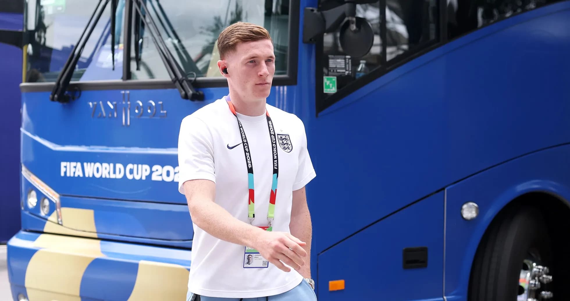 Player walking near team bus before match
