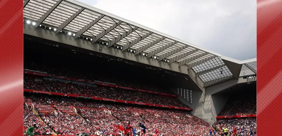 Crowd at stadium during football match action