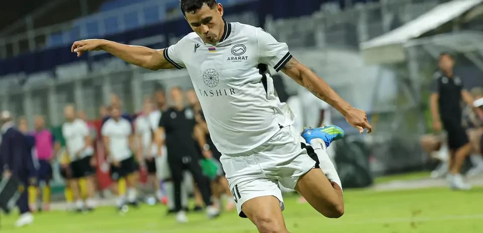 Ararat-Armenia player taking a shot on goal