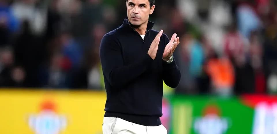 Coach clapping on the sidelines during a match
