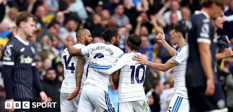 Players celebrating a goal during a football match