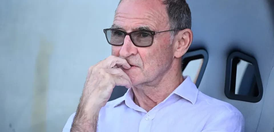 Man in glasses sitting on sports bench