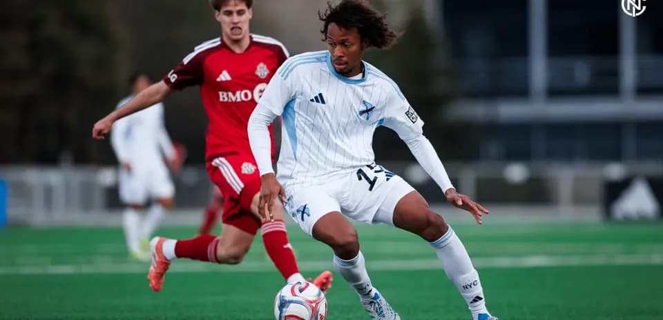 Toronto II player challenging New York RB II opponent