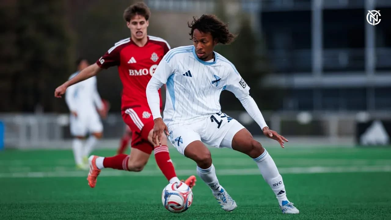 Toronto II player challenging New York RB II opponent