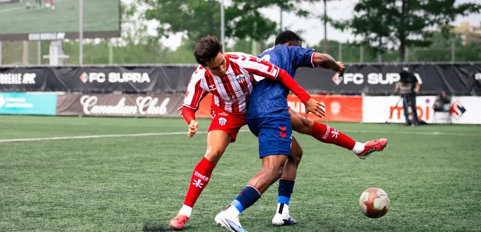 Players competing for the ball during match
