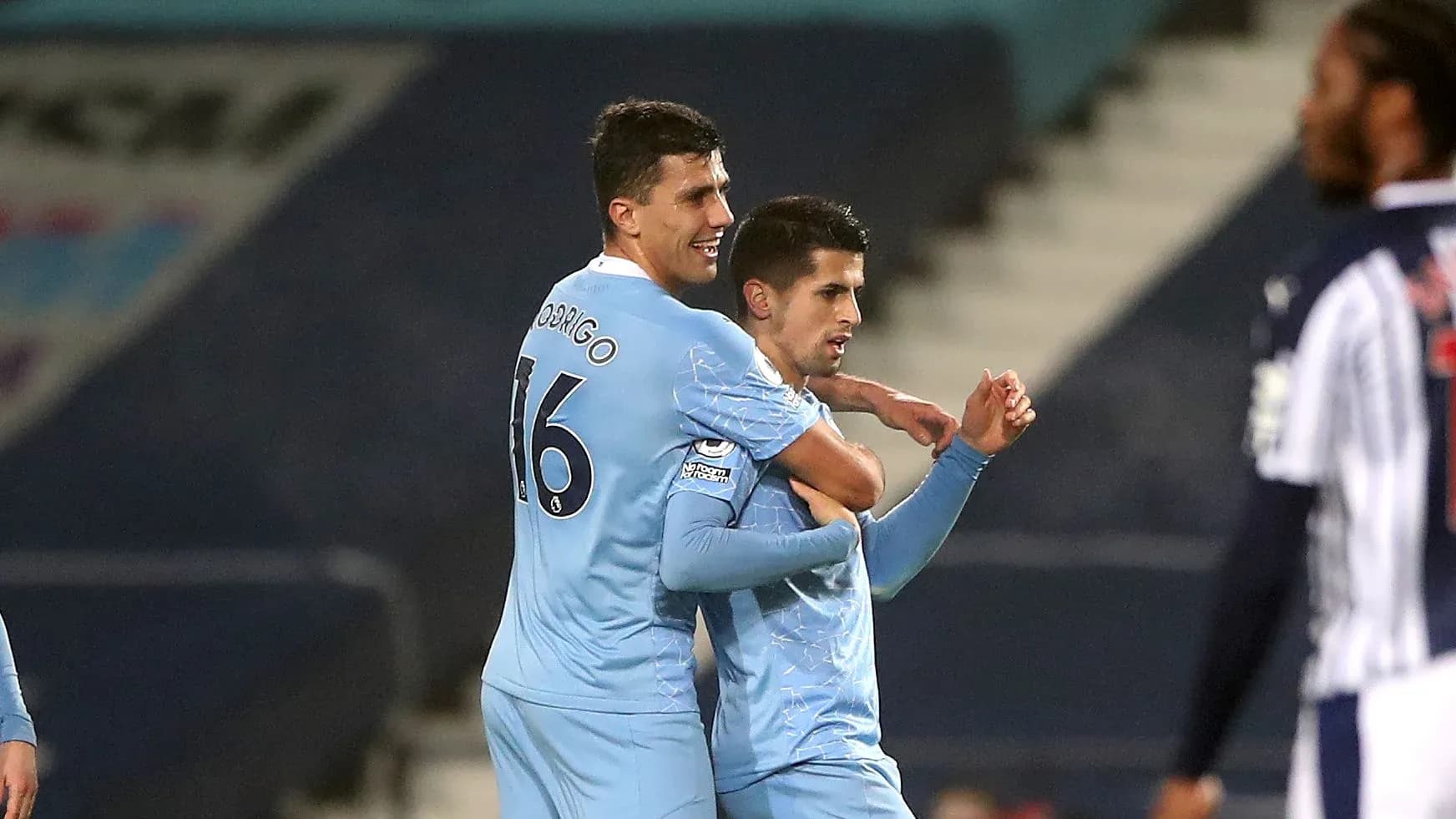 Players celebrating a goal during a match