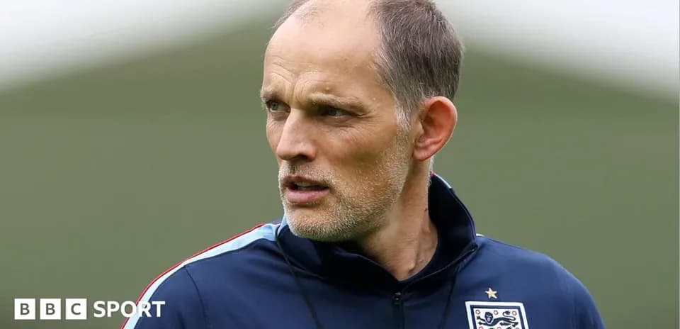 Football coach observing training session