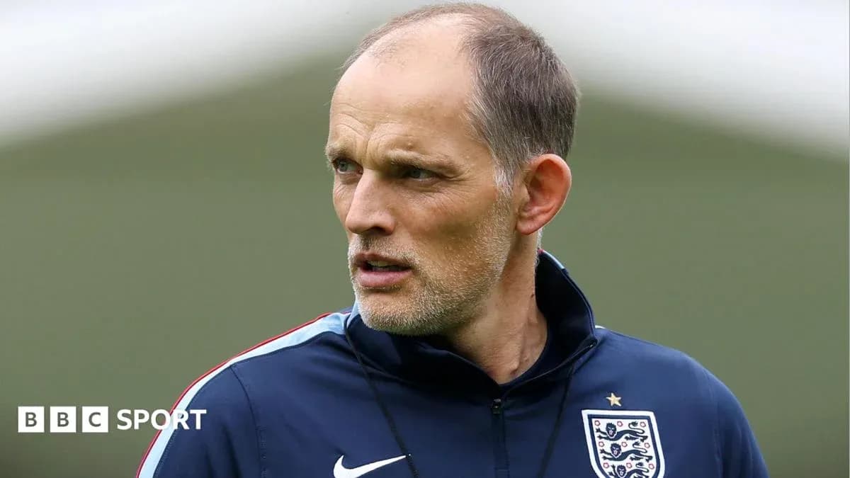 Football coach observing training session