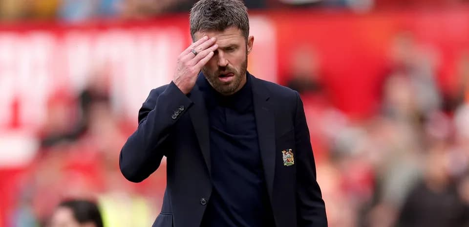 Manager walking on the pitch during a match