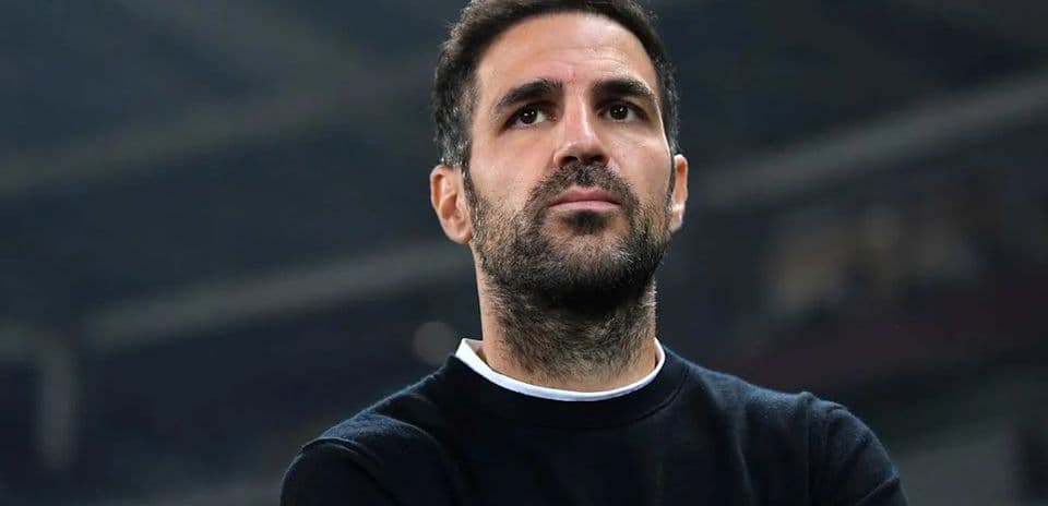 Man looking contemplative in a stadium setting